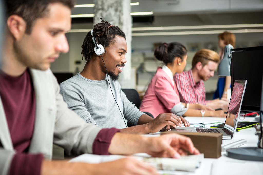 Multiethnic group of young business people working at their office.